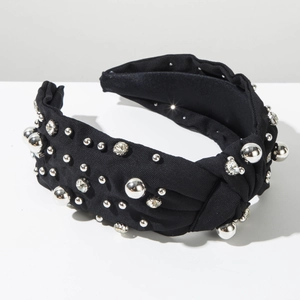Close-up of black twisted headband with silver metallic beads and clear rhinestones
