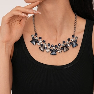 Close-up of statement necklace with navy blue and clear crystals on gunmetal chain
