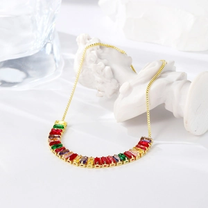 Detailed view of adjustable golden chain with rainbow zirconia stones in a luxury setting
