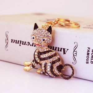 Porte-clés chat chanceux noir et or avec strass blancs pour décoration de sac ou voiture