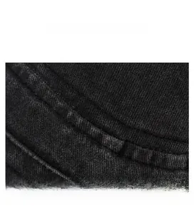Detailed macro shot of fine stitching on washed cotton fabric of a flat top cap