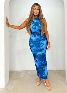 Detailed close-up showing the blue abstract print and slim fit of the sleeveless maxi dress