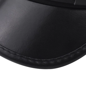 Detailed macro view of black leather brim with fine stitching and smooth grain texture