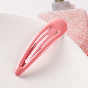 Detailed view of a 5cm pink candy-colored metal hair clip with a smooth glossy finish