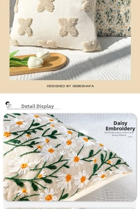 Detailed view of floral daisy embroidery and tufted textured decorative pillow case