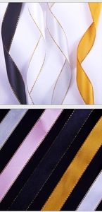 Close-up of 2cm satin ribbons with gold edges in black, white, gold, pink and blue