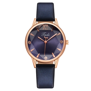 Elegant ladies rose gold watch with purple faceted dial and navy blue leather strap