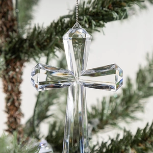 Clear acrylic crystal cross pendant with snowflake cutting hanging on Christmas tree branch