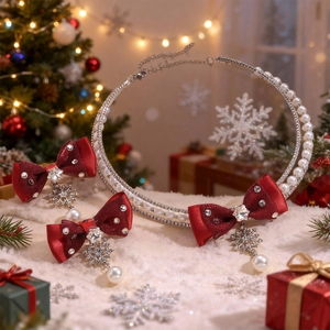 Detailed view of red bow necklace with snowflake pendant and pearl chain for Christmas
