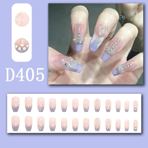 Lavender butterfly press-on nails with rhinestone accents and nude gradient style