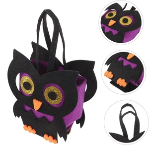 Detail of owl Halloween felt bag showing the multi-layered handle and glitter material