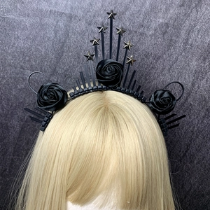 Detail of gothic halo crown with black satin roses and silver metal star accents