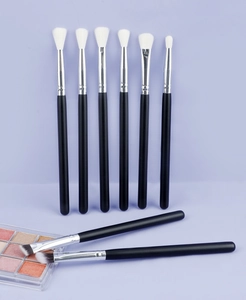 Detail showing 8-piece professional eye makeup brush set with wood handles and soft bristles