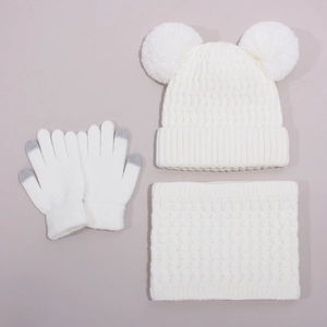 Detail of white cable knit winter set with dual faux fur pom-poms and touch screen gloves