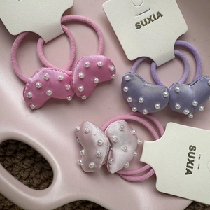 Three pairs of sweet heart-shaped hair ties with pearls in pink, purple, and champagne