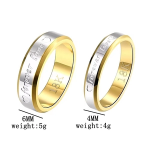 Detail view of gold and silver plated titanium steel rings with Forever Love engraving