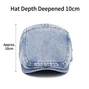 Light blue denim flat cap with white contrast stitching and deep crown design
