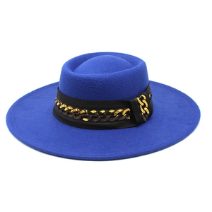 Detail of royal blue wool felt hat featuring a wide flat brim and gold chain hatband