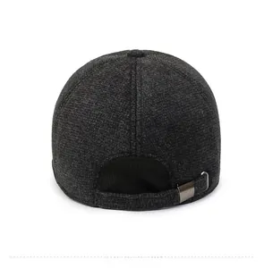Detail view of winter baseball cap back with dark gray wool texture and metal buckle