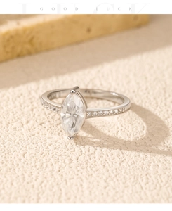 Detail view of marquise-cut 1ct moissanite ring with side stones on 925 sterling silver