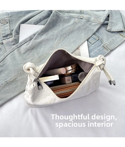Spacious interior of white cloud texture crossbody bag showing daily makeup storage