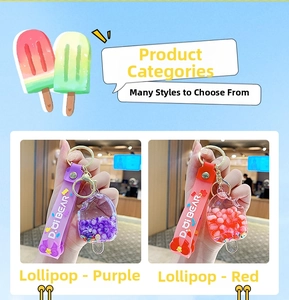 Detail of popsicle acrylic keychain with colorful beads and silicone strap in purple and red