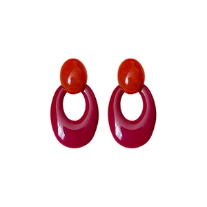 Retro hollow oval resin earrings in red and magenta tones with a high-gloss finish