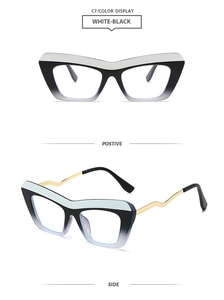 Cat eye glasses featuring black and white gradient frames and wavy golden metal temples