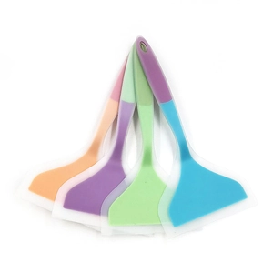 Set of four colorful silicone spatulas with translucent heads and ergonomic handles