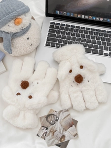Detail of white plush dog gloves with cute 3D animal embroidery and soft thermal lining