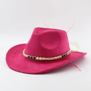 Detail of fuchsia suede cowboy hat with braided bead band and woven fiber rope decoration