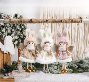 Detailed view of three long-eared angel plush ornaments with lace dresses and sequin wings