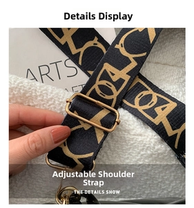 Detail of adjustable wide woven shoulder strap with gold-tone metal buckles and hooks