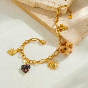Gold stainless steel multi-pendant bracelet with leopard print heart and sun charms