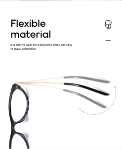 Detail showing highly flexible gold temples of cat-eye glasses with a black frame