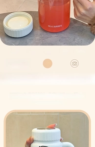 Detail of high borosilicate glass cup featuring a leak-proof orange body and seal lid