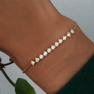 Detailed close-up of a 925 silver gold-plated tennis bracelet with single row of clear zircons