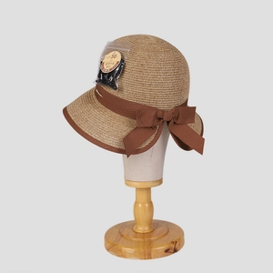 Elegant wide brim straw sun hat with bow tie and UPF 50+ protection for travel