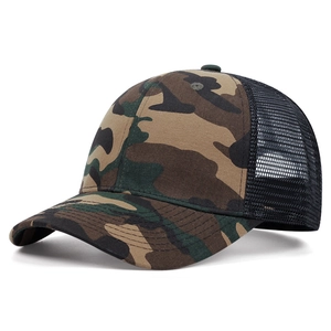 Detail of woodland camouflage truck cap featuring breathable black mesh and curved brim