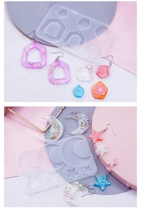Detailed view of moon, star, and geometric silicone molds with finished resin jewelry pieces