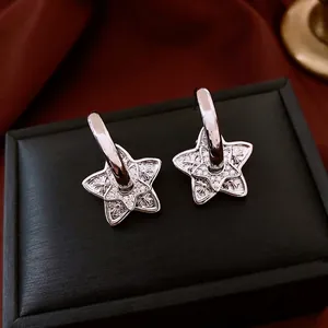 French luxury silver star earrings with double-layered crystal cross pattern design