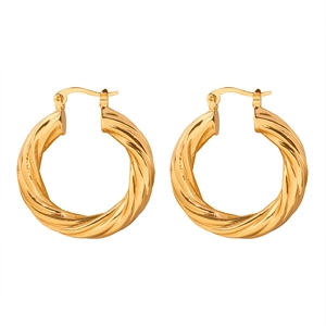 Polished gold twisted hoop earrings with elegant textured geometric design on white background