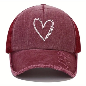 Close-up of heart butterfly print on distressed burgundy mesh trucker baseball cap