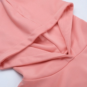 Detail shot of a pink drawstring hoodie featuring soft knitted fabric texture and hood