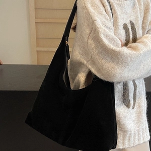 Minimalist black suede hobo shoulder bag for women with golden zipper and leather strap