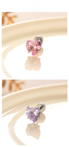 Detail of 6mm heart-shaped zircon earrings in pink and purple with 4-prong setting