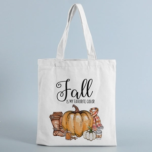 Detail of canvas tote bag featuring autumn pumpkin illustrations and Fall theme text