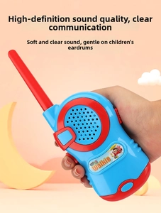 Handheld view of child walkie talkie featuring blue red casing and cartoon pilot sticker