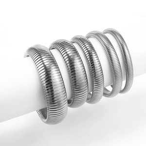 Close-up of five silver-tone elastic Tubogas style bracelets on a white display