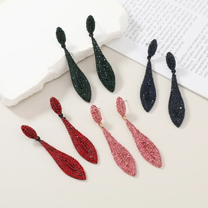 Luxury rhinestone teardrop earrings in green, blue, red, and pink colors on stone base